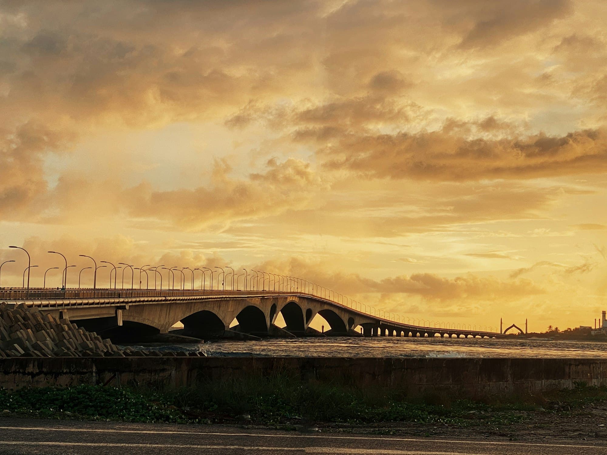 A sea bridge under an evening sky