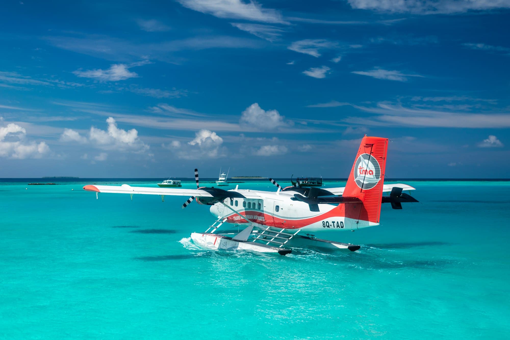 A seaplane on a turquoise lagoon